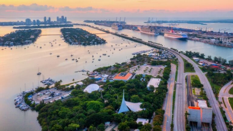 Aerial view of Miami coastline showing nearby suburbs, perfect for families seeking vibrant and accessible communities.