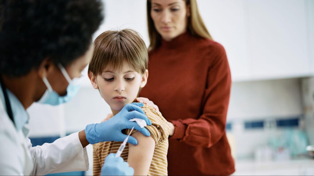 Child receiving a vaccination to meet Florida school immunization requirements.