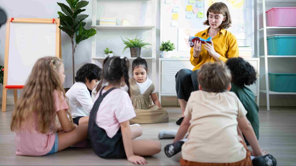 Teacher reading to children during circle time in a Miami early childhood classroom, supporting literacy and early learning.