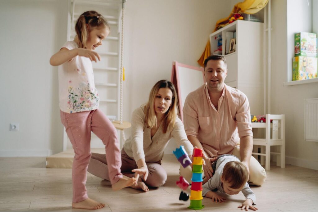 Family practicing school readiness skills and routines at home to support their child’s transition into Miami early childhood education programs.